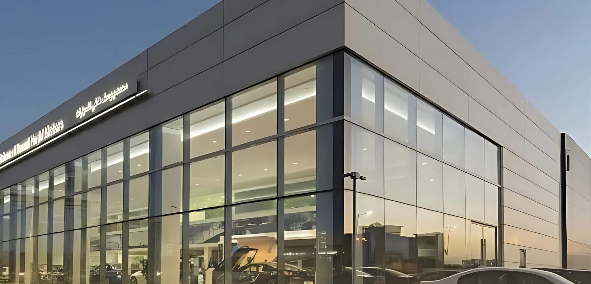 Car showroom facade with cladding and structural glazing in Riyadh