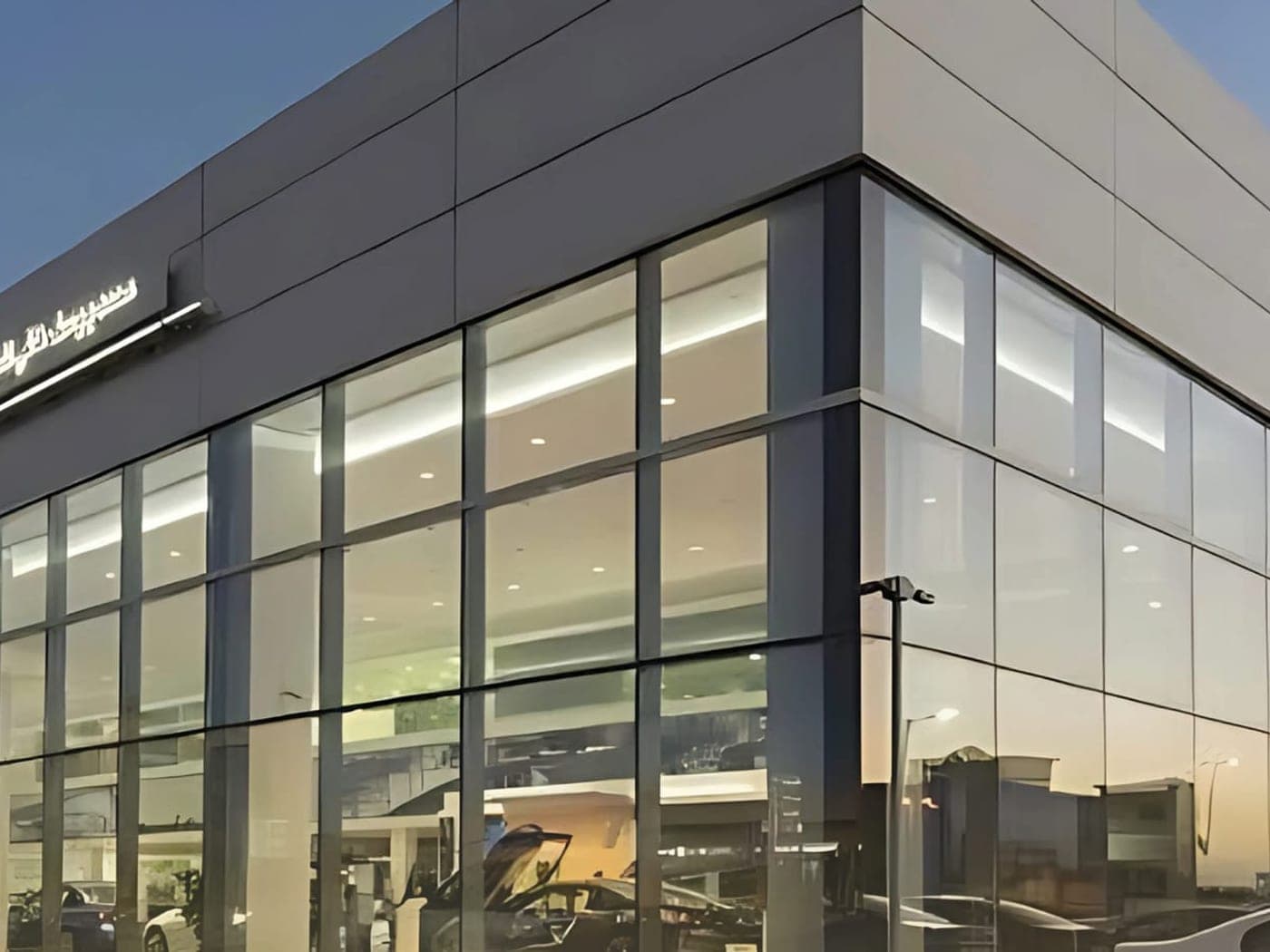 Glass entrance of a commercial building with automatic doors in Riyadh
