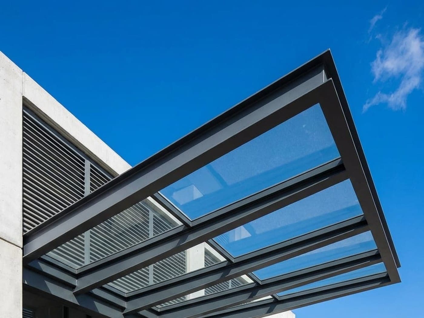 Modern aluminum pergola structure with glass roof